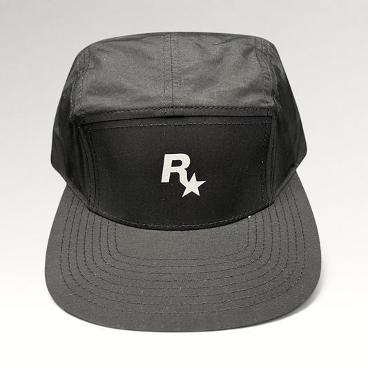 Raree Finds black nylon 5-panel camp hat by Yupoong featuring a white Rockstar Games logo on the front