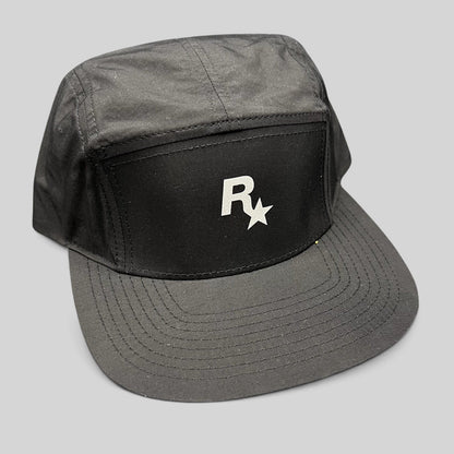 Raree Finds black nylon 5-panel camp hat featuring a white Rockstar Games logo on the front with a flat brim.