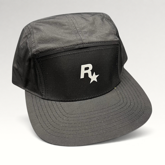 Raree Finds black nylon 5-panel camp hat featuring a white Rockstar Games logo on the front with a flat brim.