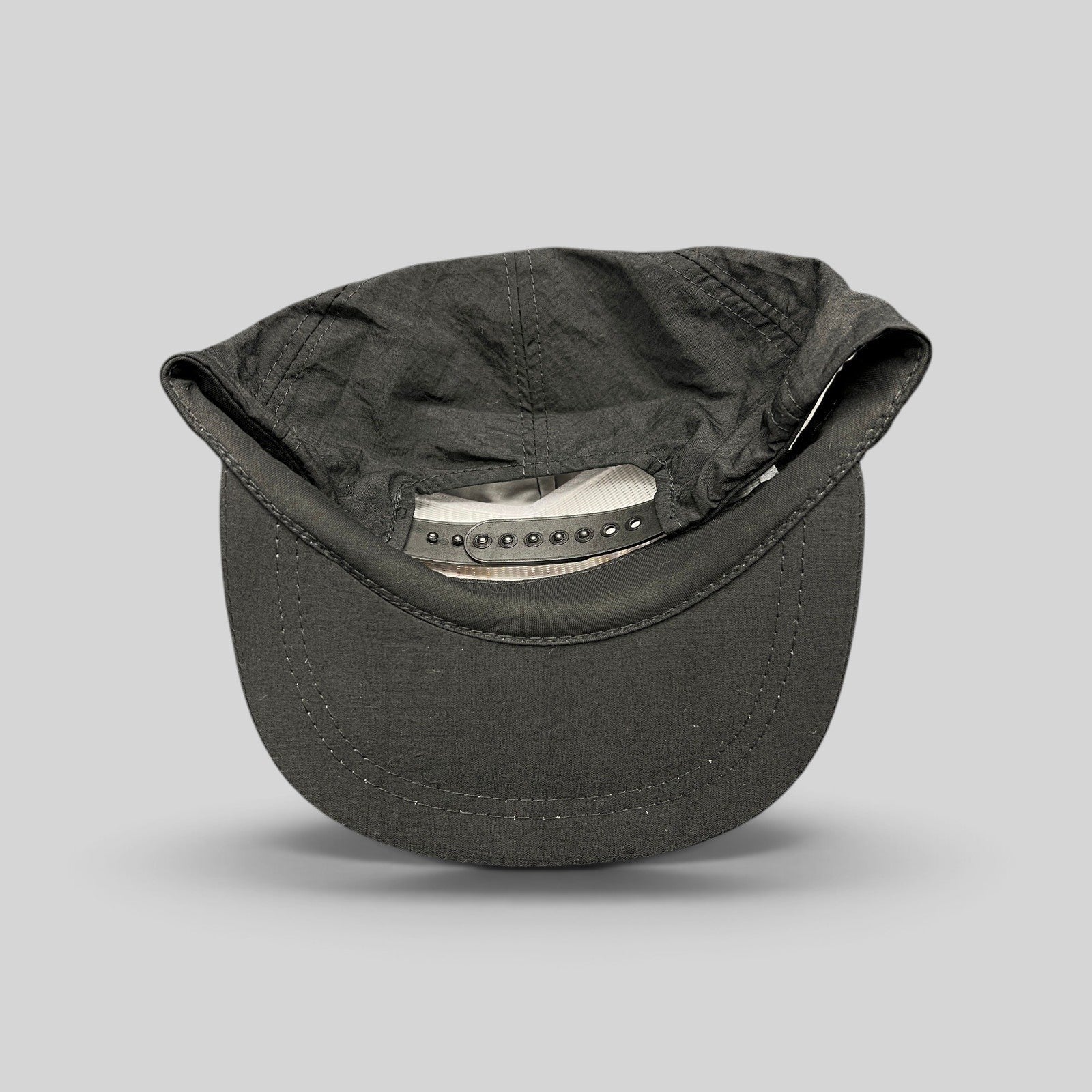 Raree Finds vintage 1995 Aspen Air Show black nylon snapback hat, interior view showing adjustable strap and crown.