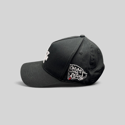 Raree Finds black Okami Brand strapback hat with white LV embroidery and side wolf graphic patch