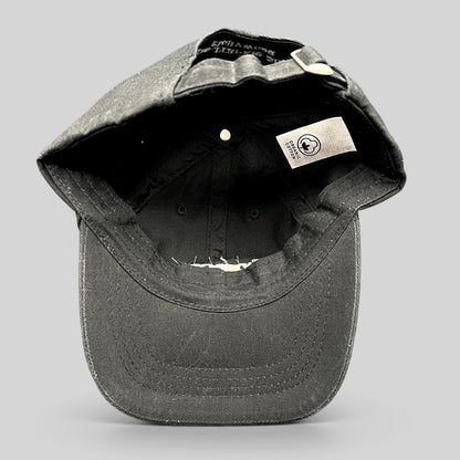 Raree Finds black organic cotton dad cap interior view showing the organic cotton label and adjustable strapback.