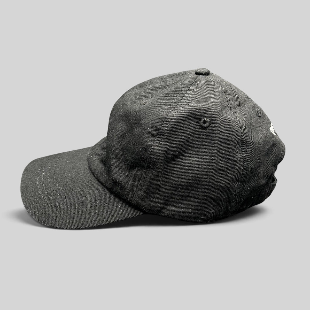 Raree Finds black organic cotton dad cap with a low-profile unstructured crown and curved brim