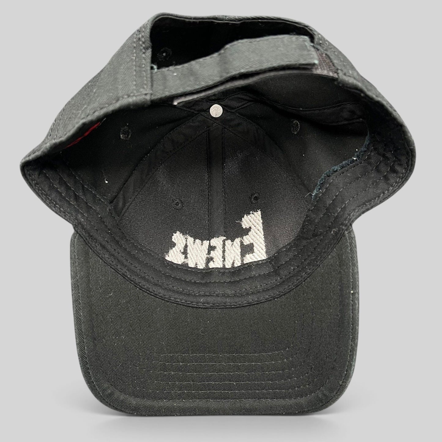 Raree Finds vintage black OTTO Cap snapback hat featuring an embroidered E! News logo on the interior crown