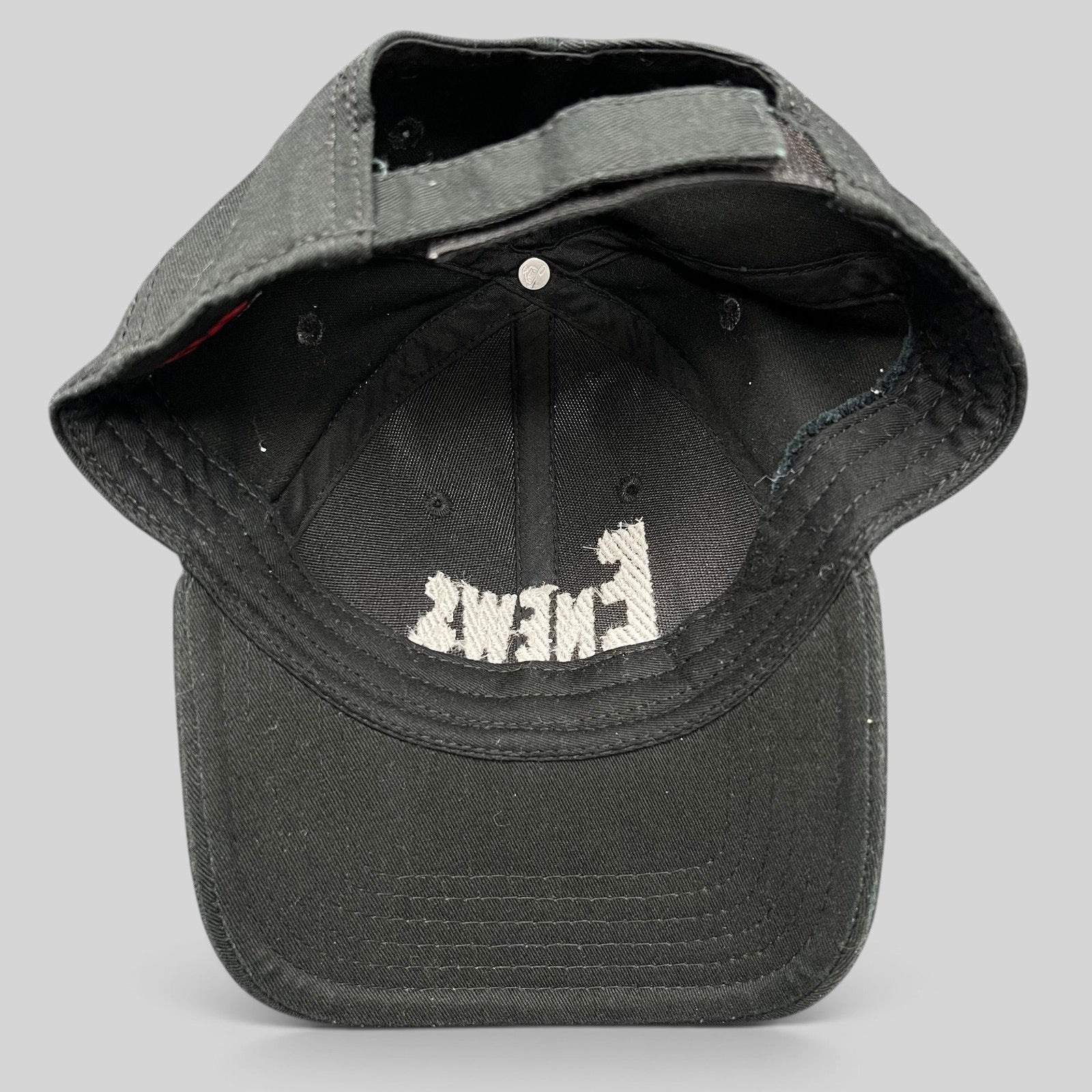 Raree Finds vintage black OTTO Cap snapback hat featuring an embroidered E! News logo on the interior crown