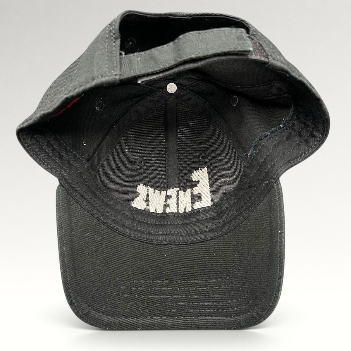 Raree Finds vintage black OTTO Cap snapback hat featuring an embroidered E! News logo on the interior crown