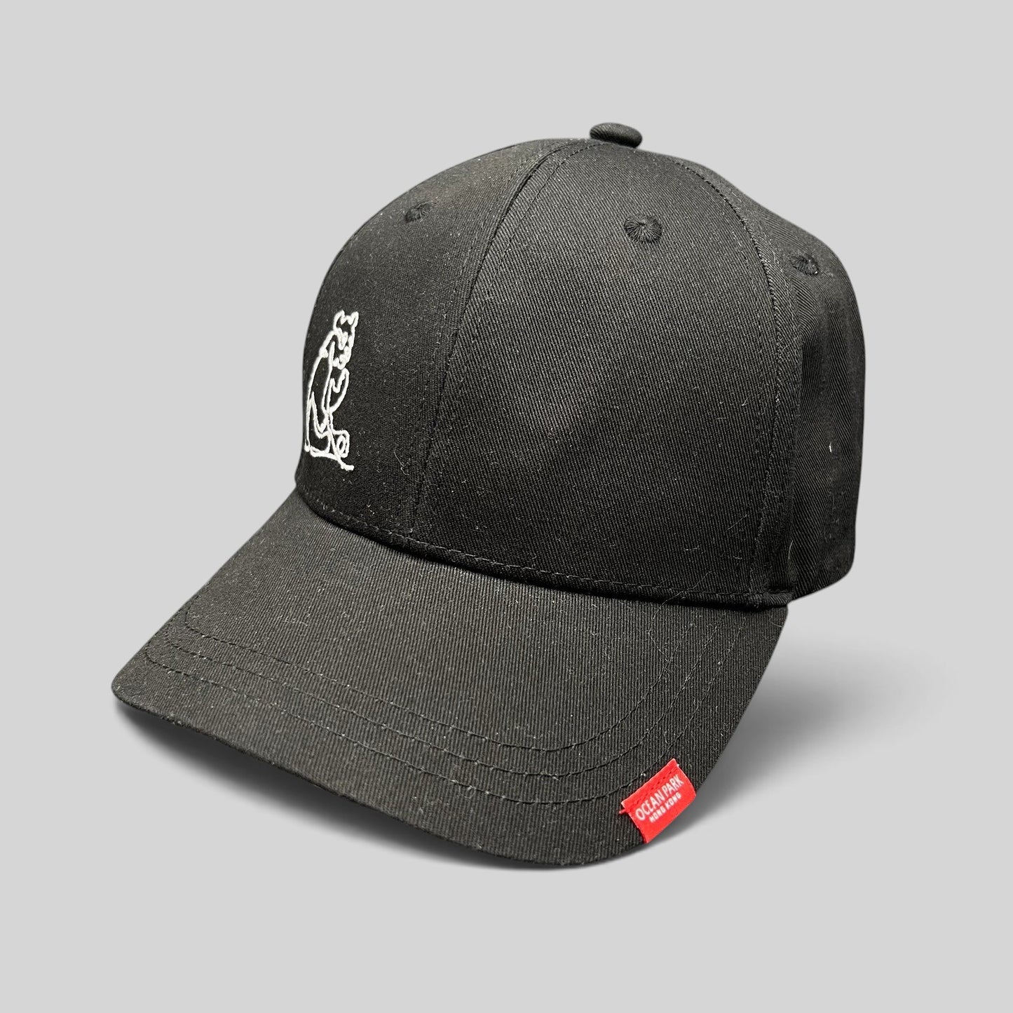 Raree Finds black strapback cap with white embroidered panda graphic and red Ocean Park Hong Kong logo tab