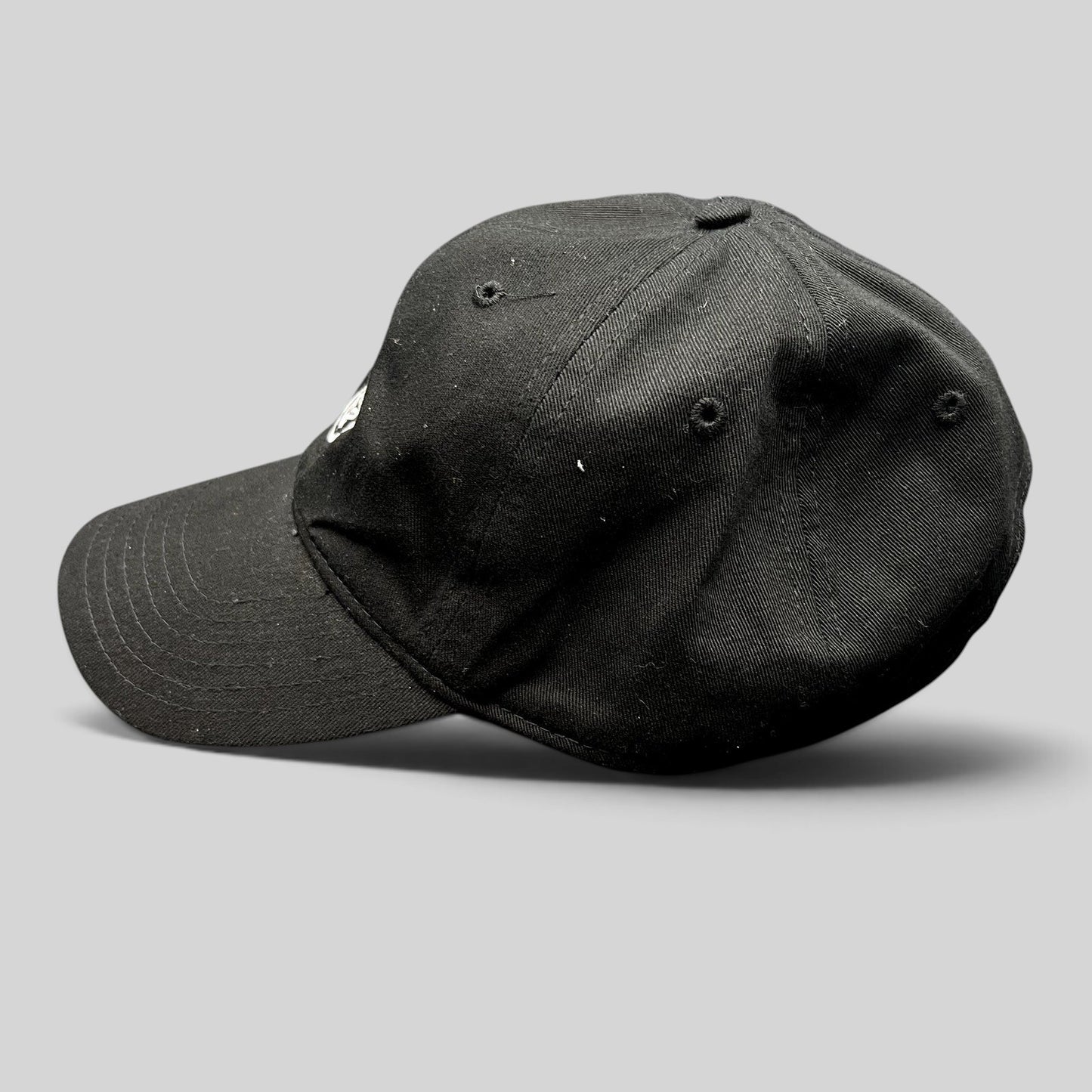 Raree Finds black Marvel Black Panther strapback hat with embroidered mask logo, side profile view.