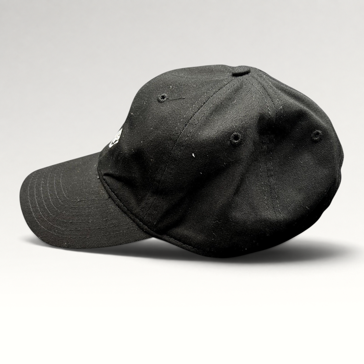 Raree Finds black Marvel Black Panther strapback hat with embroidered mask logo, side profile view.