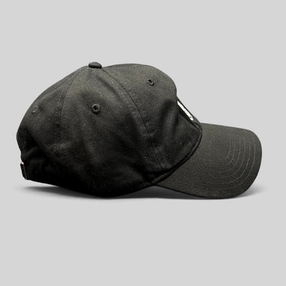 Raree Finds black Marvel Black Panther strapback hat with embroidered mask logo, side profile view.