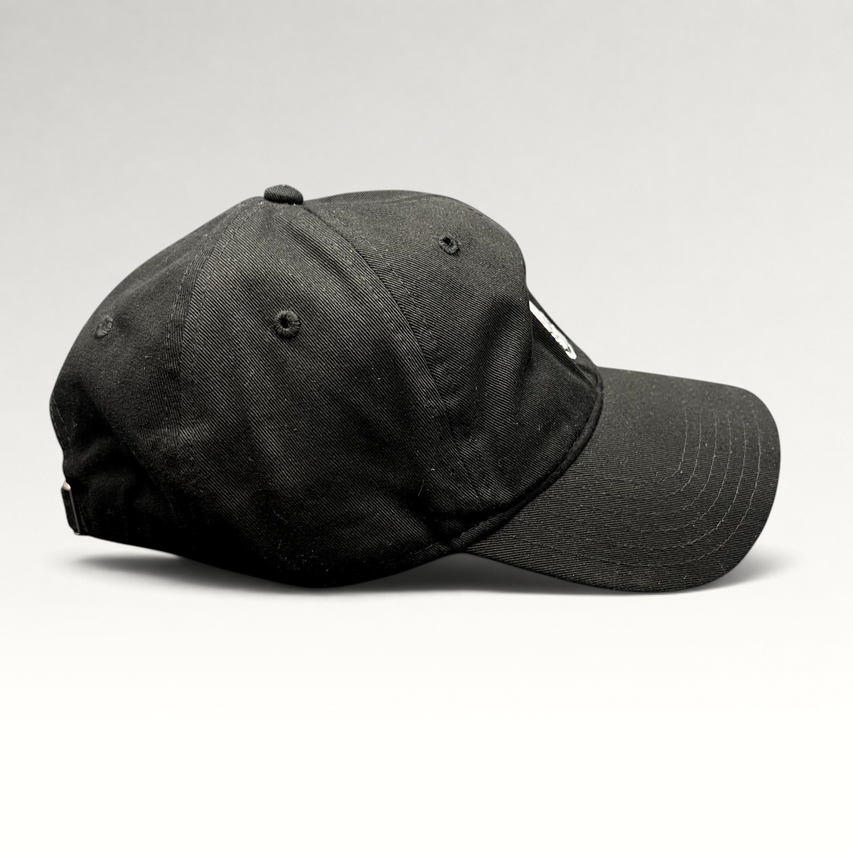 Raree Finds black Marvel Black Panther strapback hat with embroidered mask logo, side profile view.