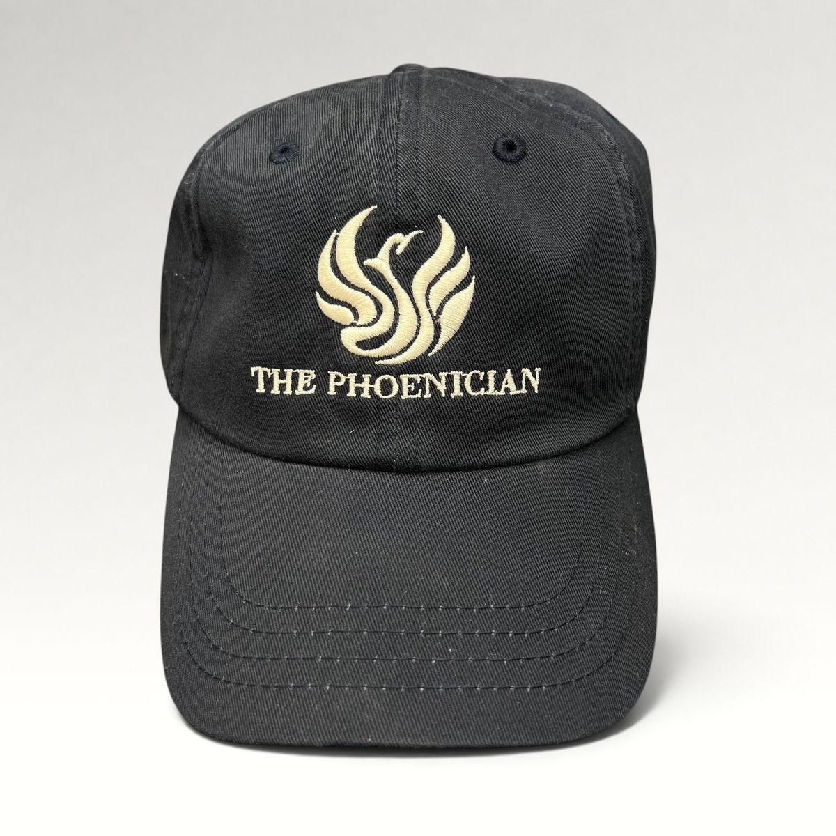 Raree Finds black cotton strapback dad cap with embroidered The Phoenician phoenix logo and script on the front