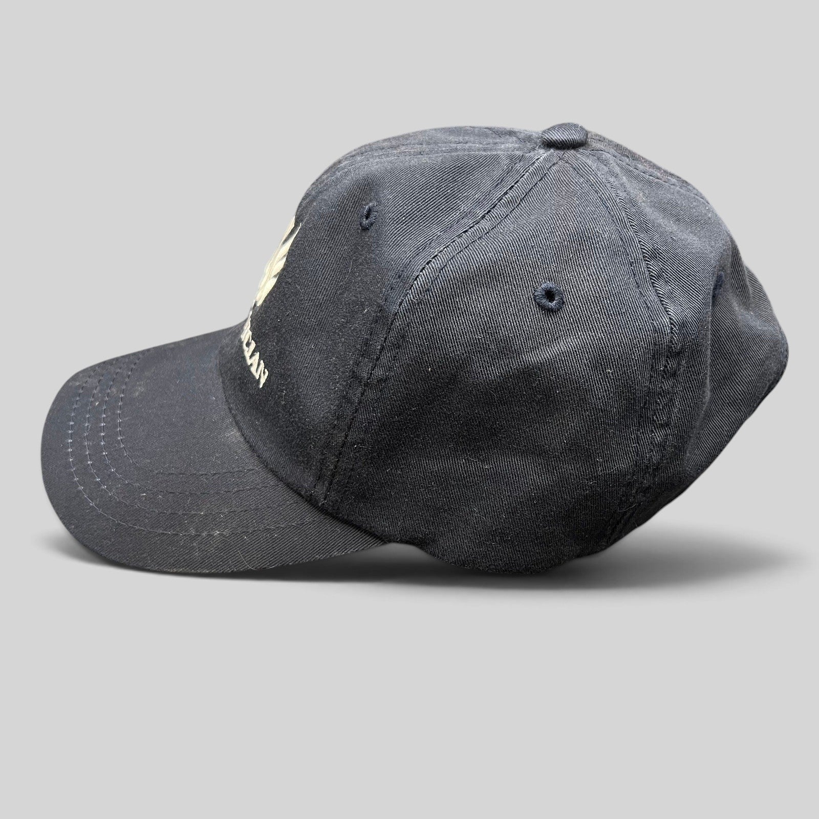 Raree Finds black cotton strapback dad cap with embroidered The Phoenician Scottsdale golf club logo and curved brim