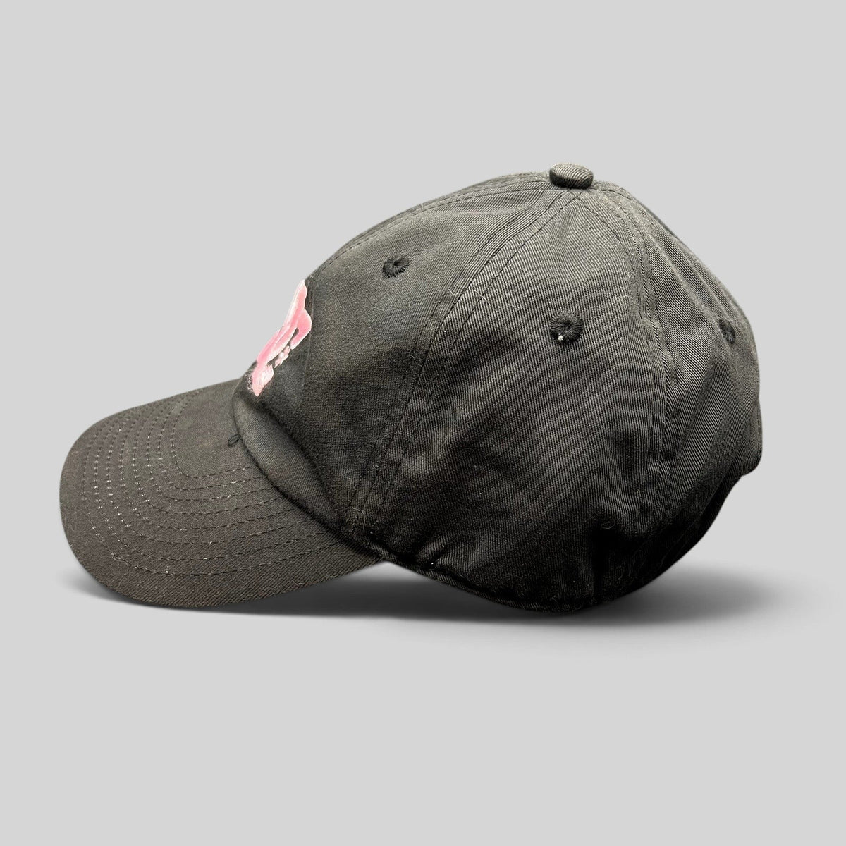 Raree Finds black cotton strapback hat with pink embroidered DC Shoes logo, low-profile skate streetwear cap