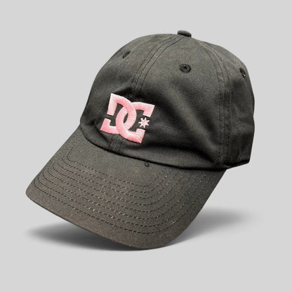 Raree Finds black cotton strapback hat featuring an embroidered pink DC Shoes logo in a low-profile skate style.