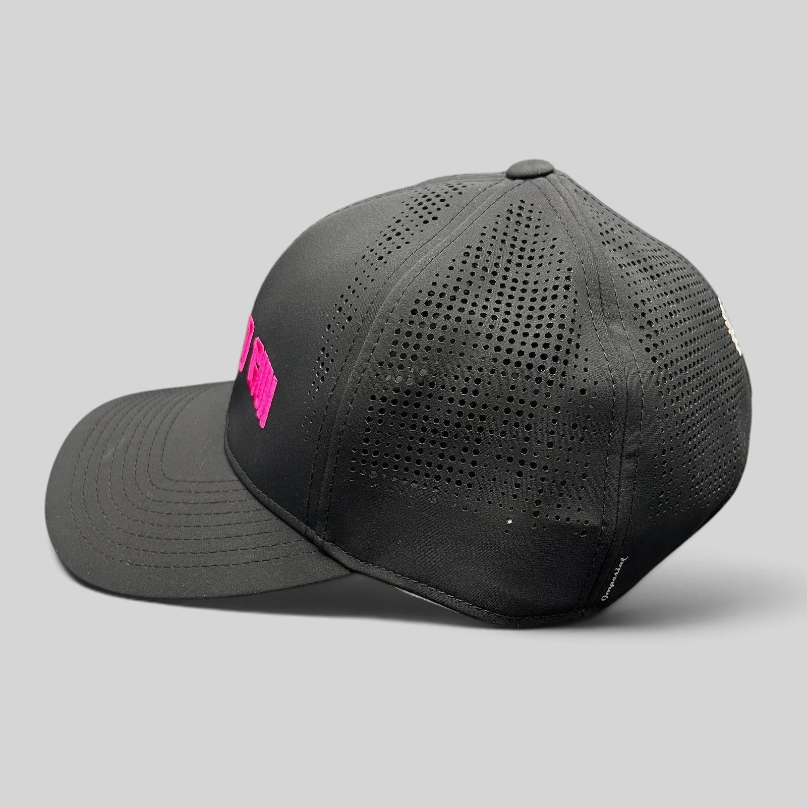 Raree Finds black performance snapback hat with hot pink The Naked Gun embroidery and perforated side panels