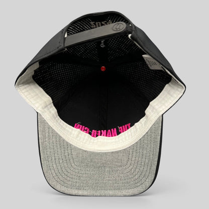 Raree Finds black performance snapback hat with pink The Naked Gun embroidery, showing interior construction.