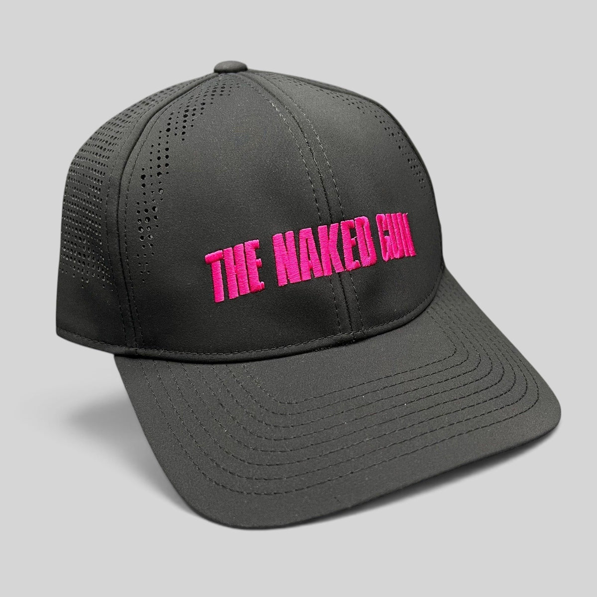 Raree Finds black performance snapback hat with hot pink The Naked Gun embroidery and perforated side panels.