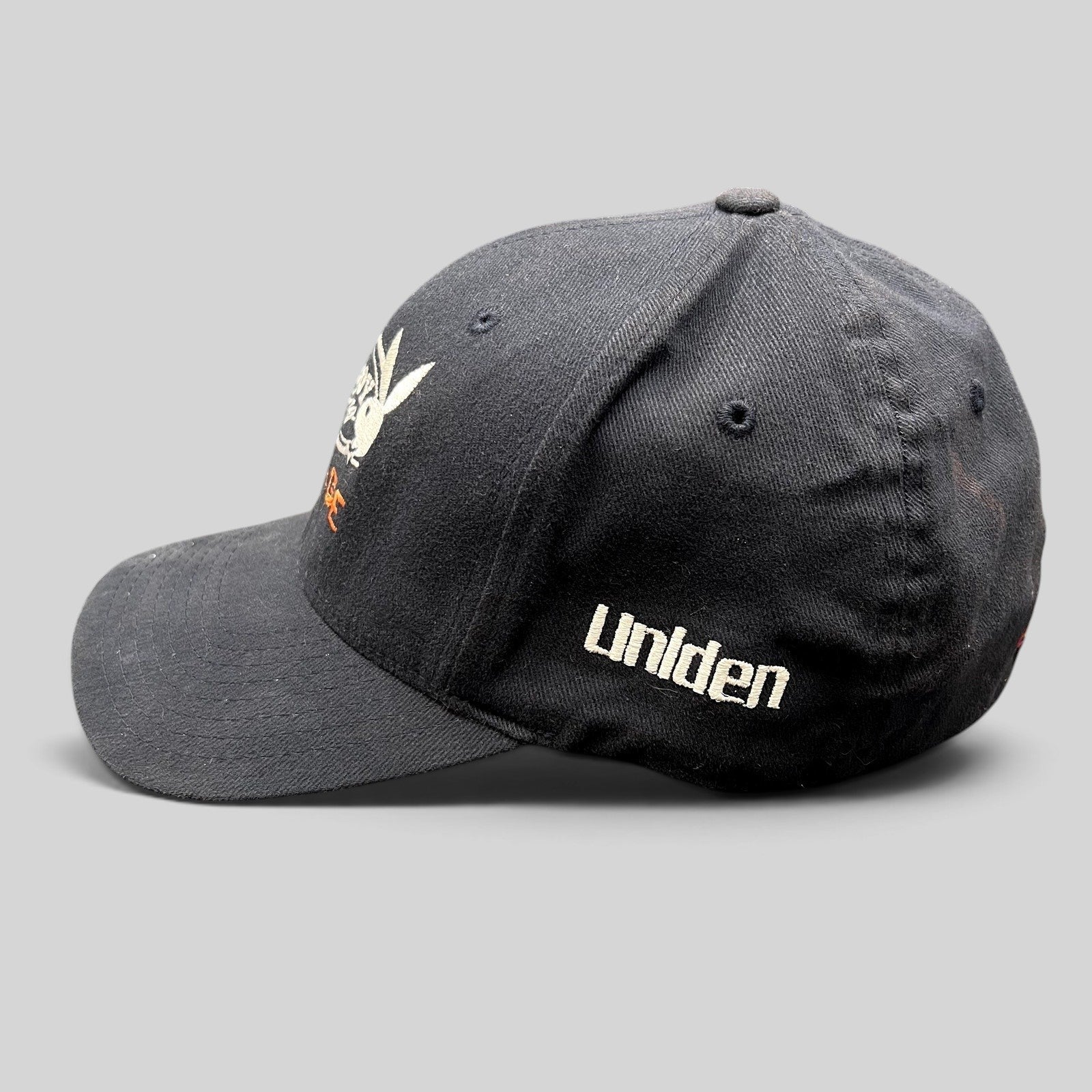 Raree Finds black Playboy Racing Flexfit cap with Uniden side embroidery and structured stretch-fit design