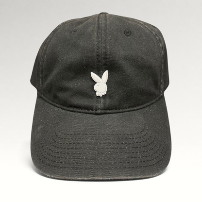 Raree Finds black strapback hat featuring a minimalist silver metal Playboy bunny logo on the front crown.