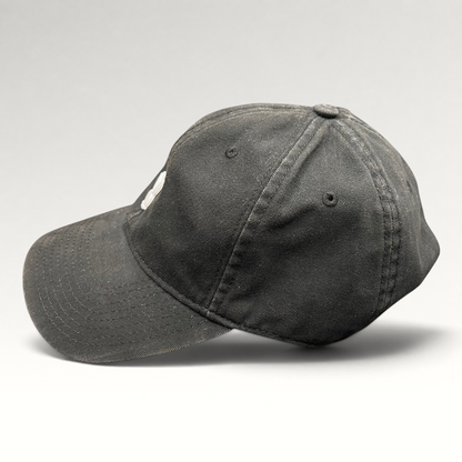 Raree Finds black cotton strapback hat featuring a minimalist metal Playboy bunny logo on the front crown