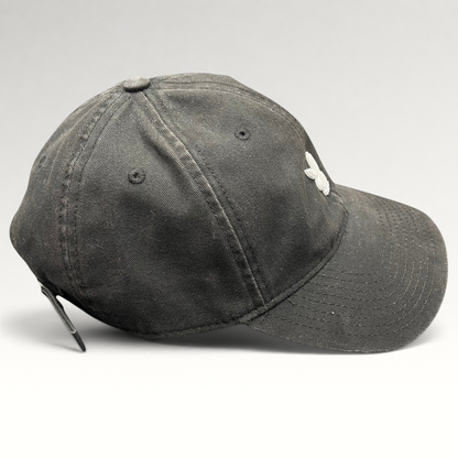 Raree Finds black cotton strapback hat with a minimalist metal Playboy bunny logo on the front crown