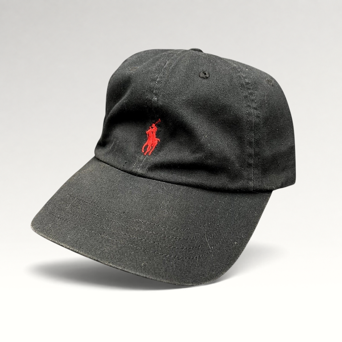 Raree Finds black cotton twill Polo Ralph Lauren strapback hat with a red embroidered pony logo on the front