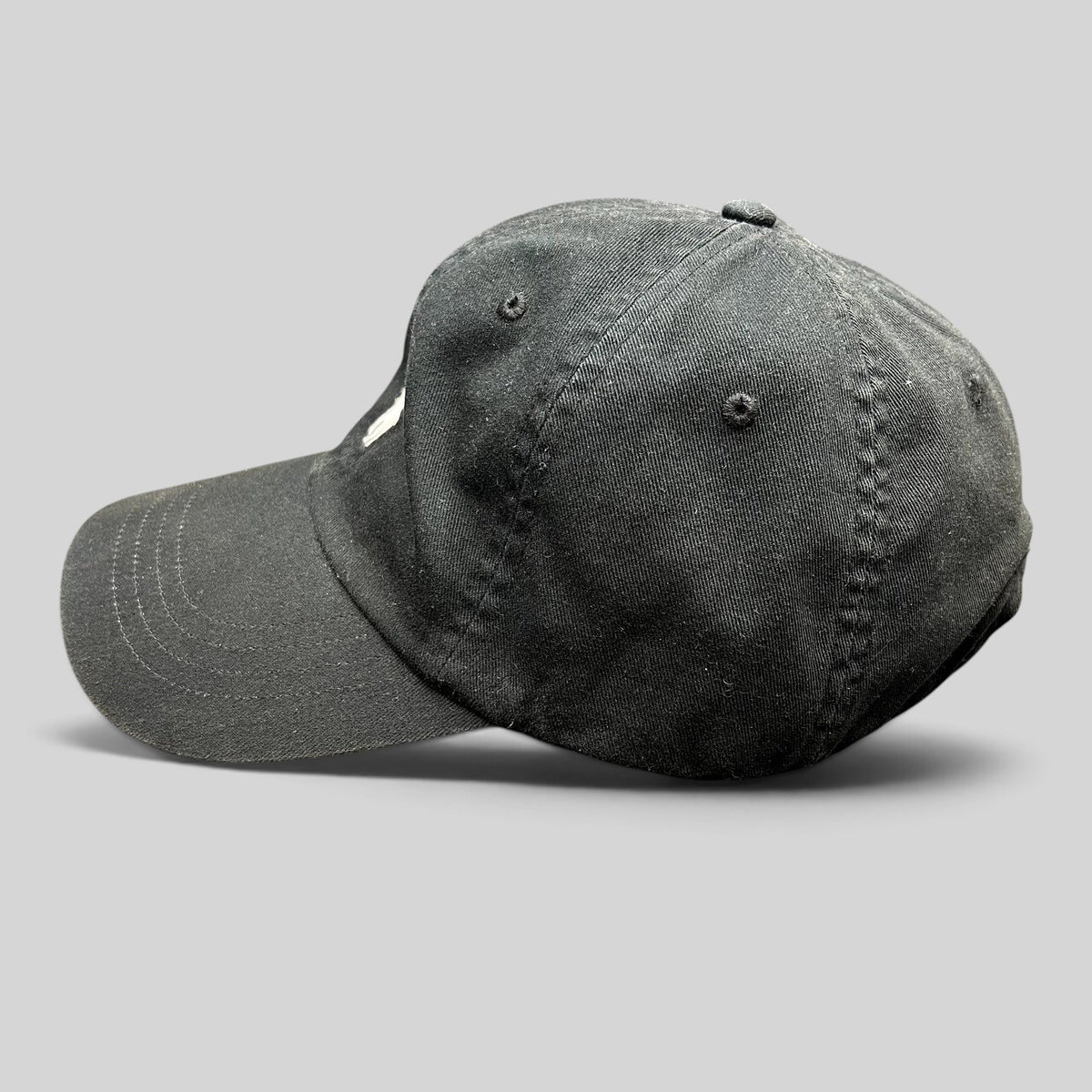Raree Finds black cotton twill Polo Ralph Lauren strapback hat with white embroidered pony logo, side profile view.