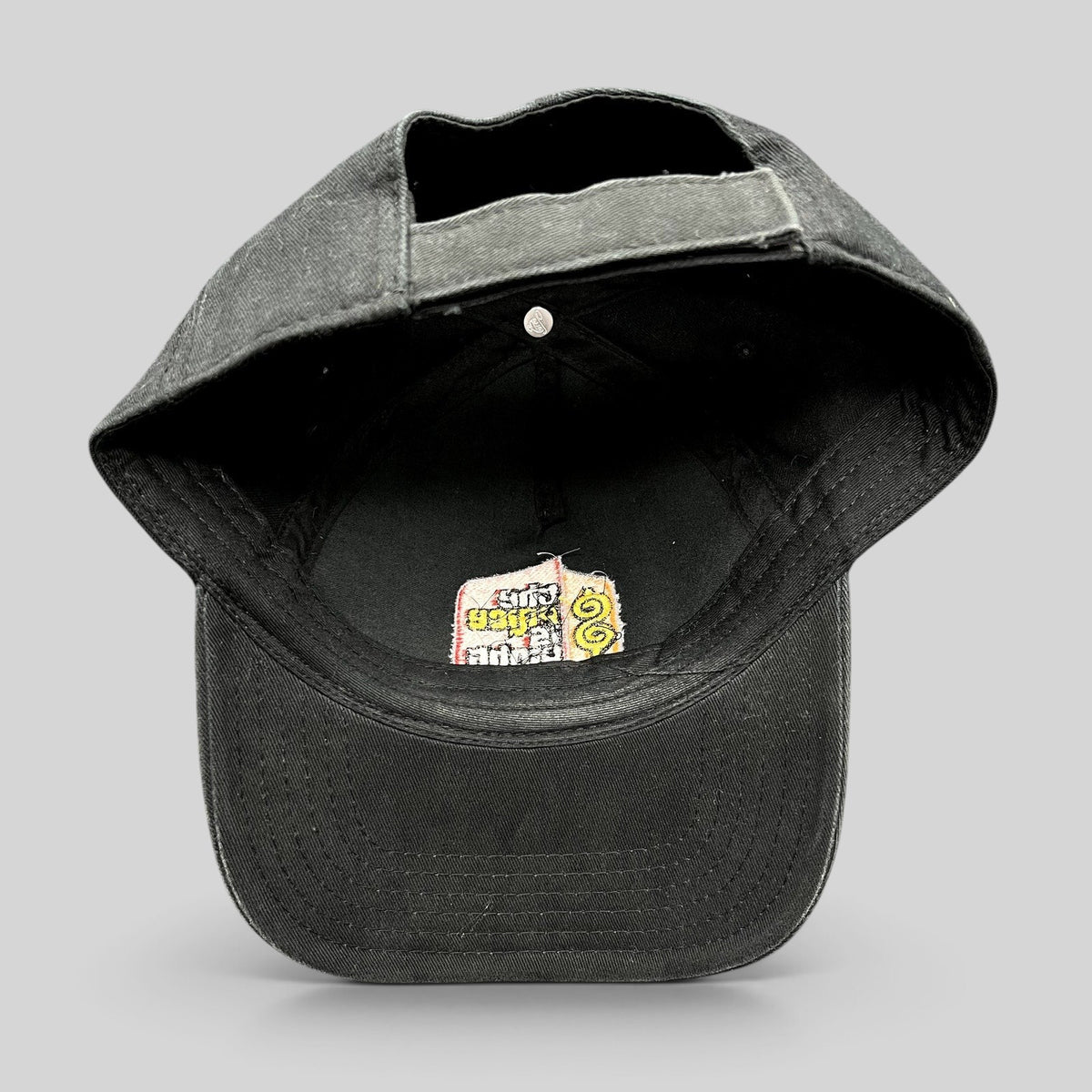 Raree Finds black cotton strapback hat with The Price Is Right logo embroidered on the interior crown