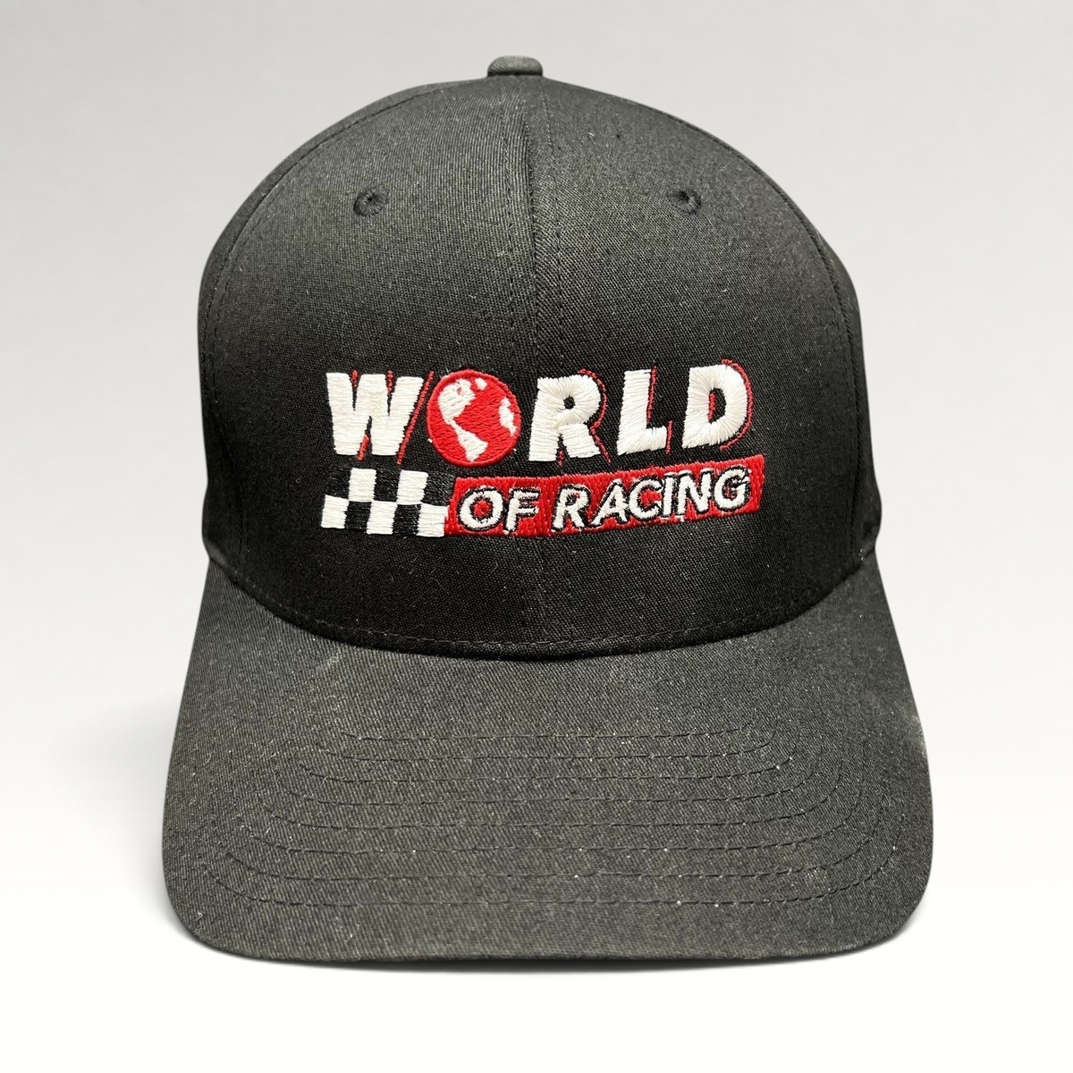 Raree Finds black Port Authority flexfit hat with embroidered World of Racing logo, checkered flag, and red globe icon.