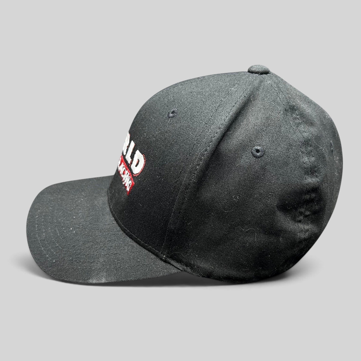 Raree Finds black World of Racing flexfit cap with embroidered motorsports graphics and a curved brim