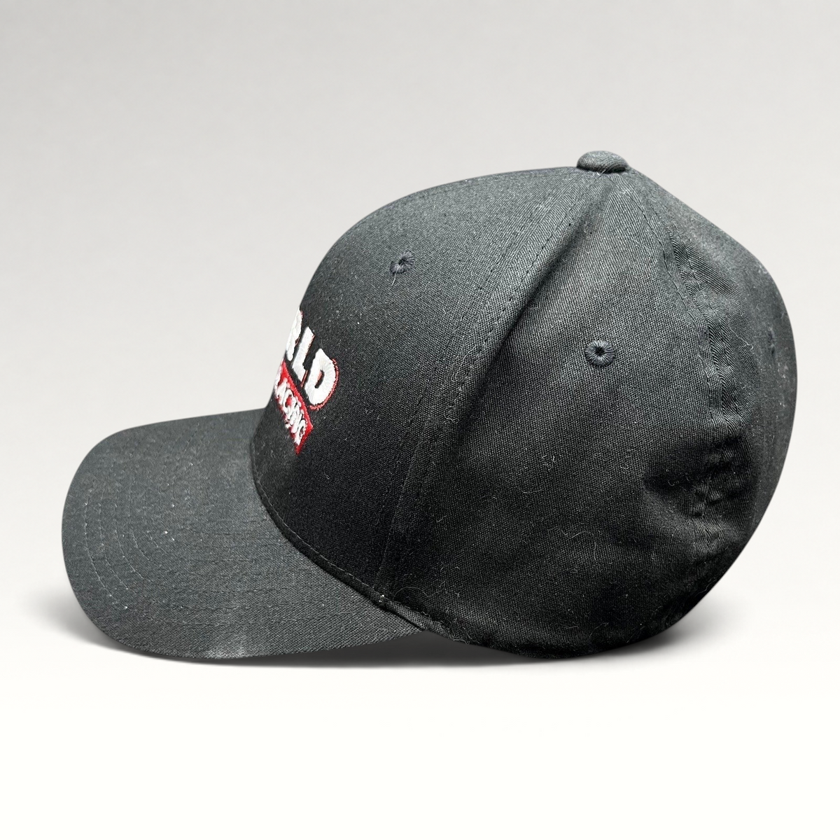 Raree Finds black World of Racing flexfit cap with embroidered motorsports graphics and a curved brim