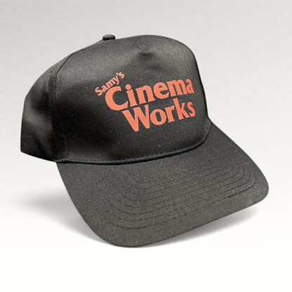 Raree Finds black cotton twill strapback hat with red Samy’s CinemaWorks embroidery on the front crown.