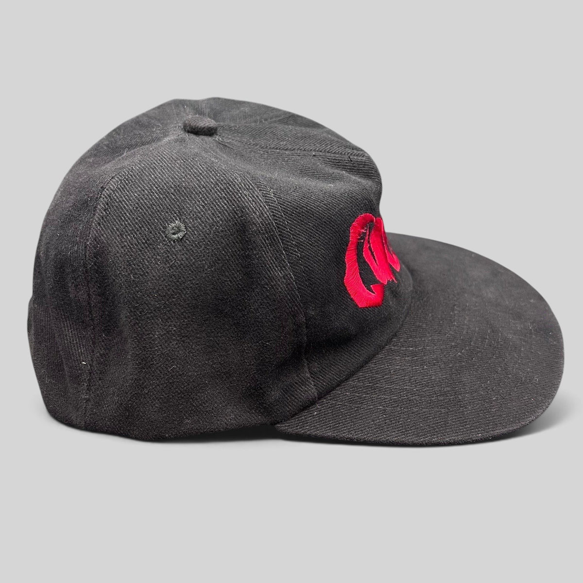 Raree Finds black cotton snapback hat with red embroidered Curdled metal band logo on the front panel