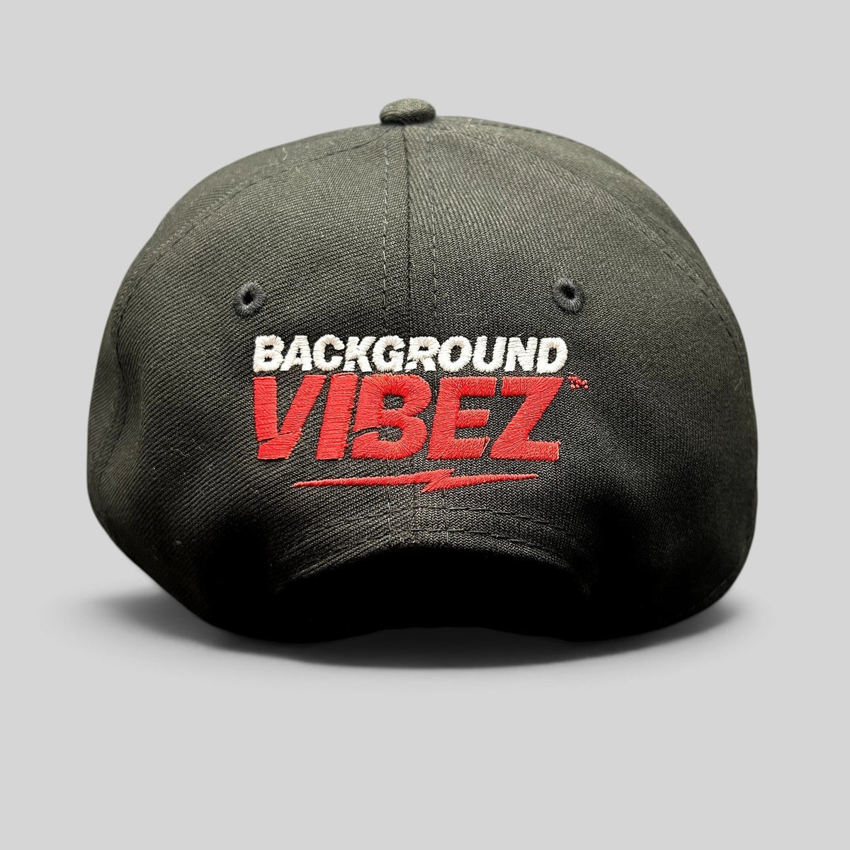Raree Finds black New Era 9FIFTY snapback hat featuring red and white Background Vibez logo embroidery on the back