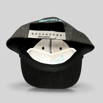 Raree Finds black Richardson Outdoor snapback hat showing the interior with Newport RI embroidery on the back strap