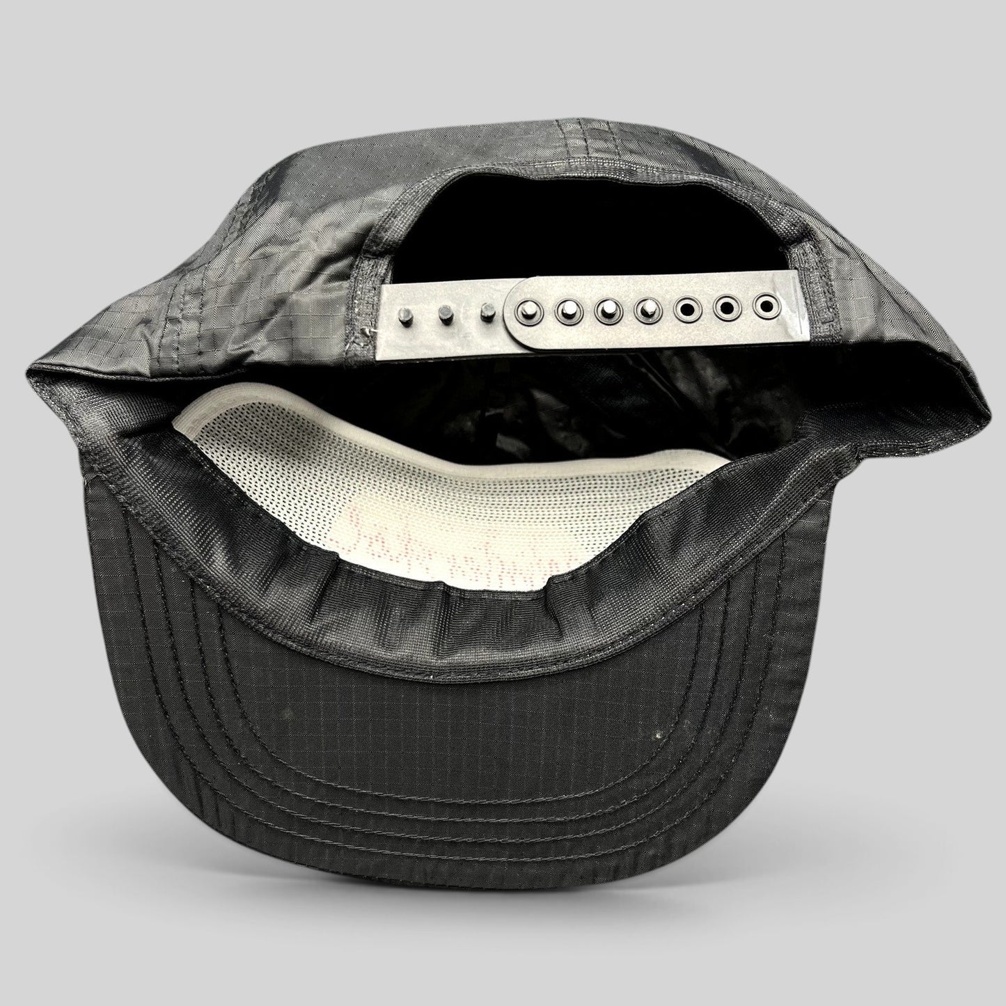 Raree Finds vintage black ripstop nylon snapback hat with adjustable closure and white interior mesh lining