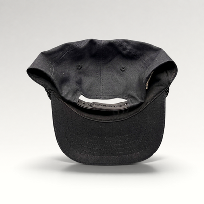 Raree Finds vintage black cotton snapback hat with rope trim and adjustable back closure, rear view.