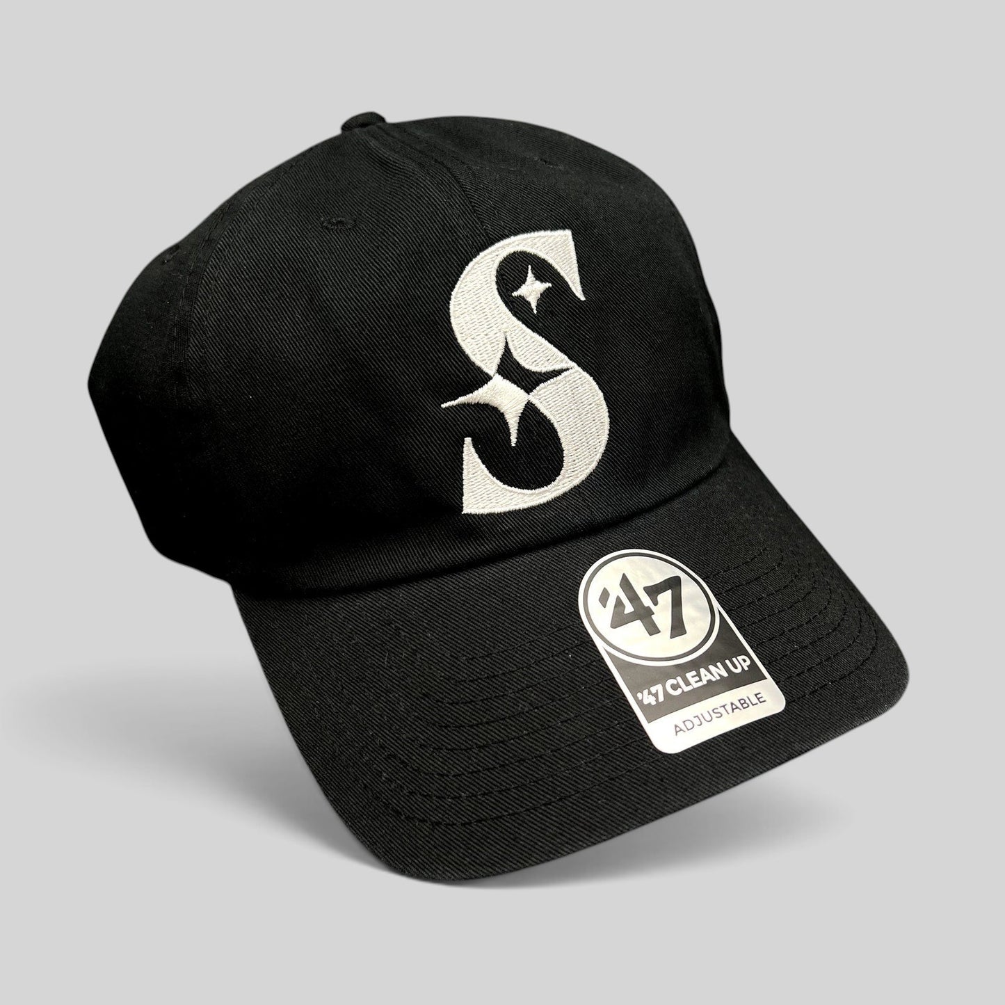 Raree Finds 47 Brand black cotton strapback hat with a white embroidered S logo and curved brim