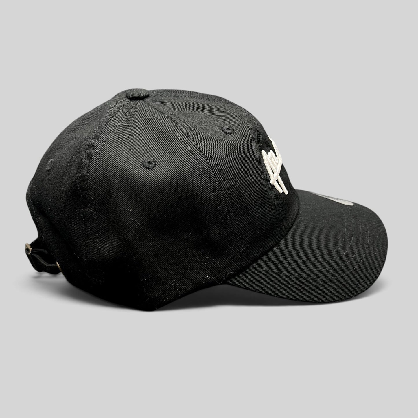 Raree Finds black cotton dad cap with white Atlantic script embroidery and adjustable strapback closure
