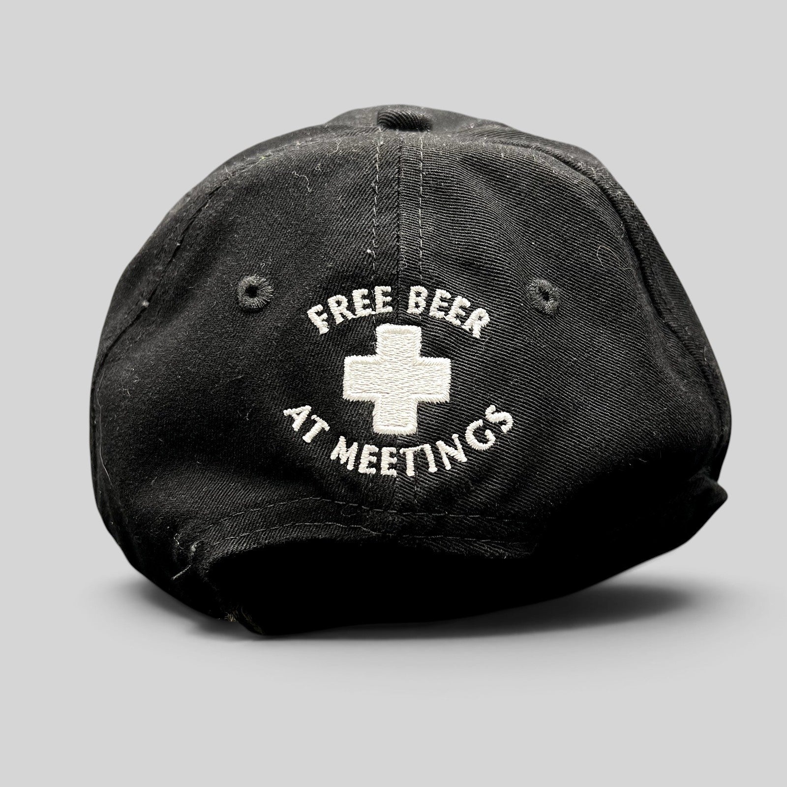 Raree Finds vintage black cotton strapback hat with white embroidered ASPA ski patrol cross and Free Beer text