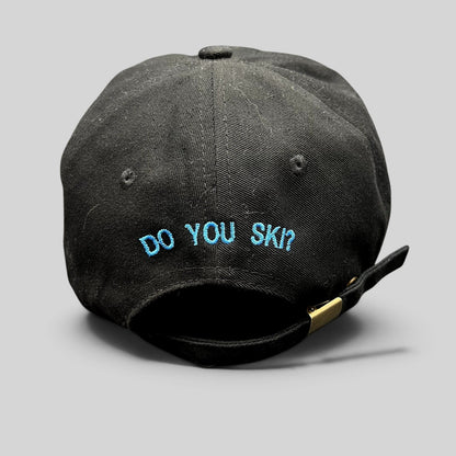 Raree Finds black cotton strapback hat with blue embroidered DO YOU SKI text on the back and adjustable metal buckle