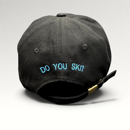 Raree Finds black cotton strapback hat with blue embroidered DO YOU SKI text on the back and adjustable metal buckle