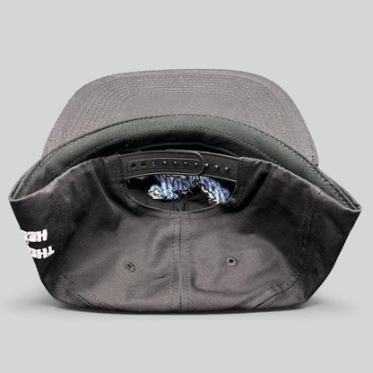 Raree Finds The Hundreds x Hello Kitty black cotton snapback hat showing the adjustable strap and interior details