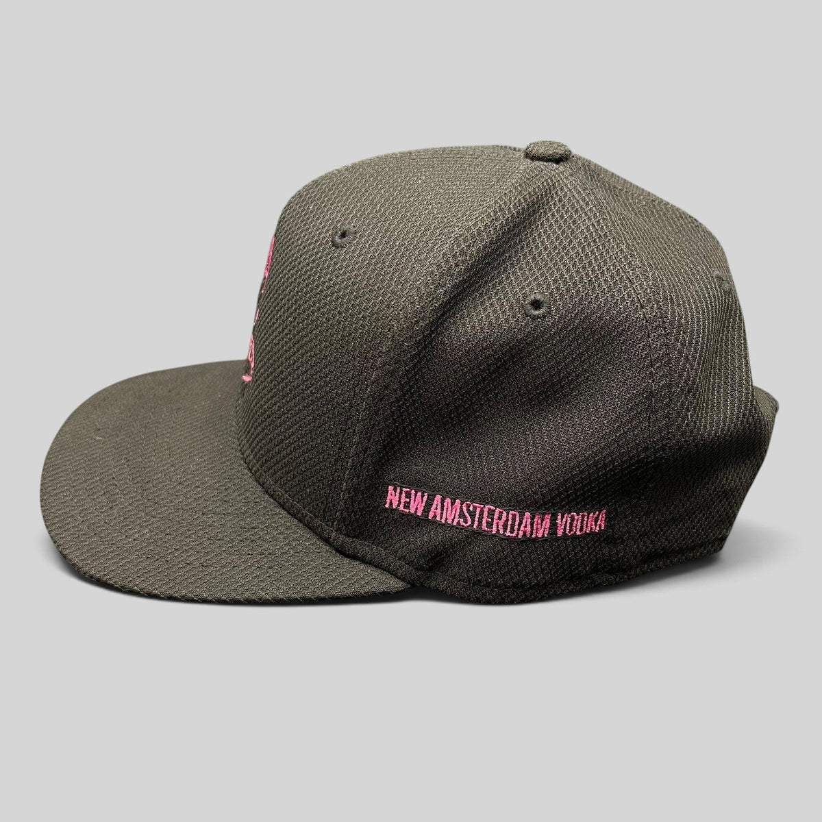 Raree Finds black New Era 9FIFTY snapback hat with pink New Amsterdam Vodka embroidery on the side
