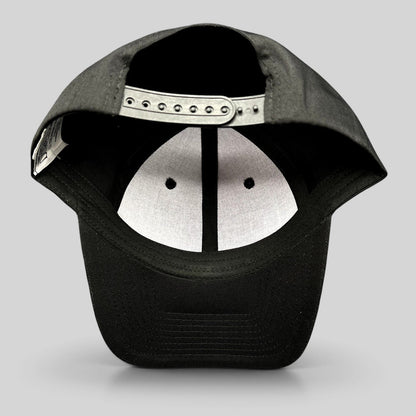 Raree Finds black snapback hat showing the interior adjustable plastic strap and white crown lining