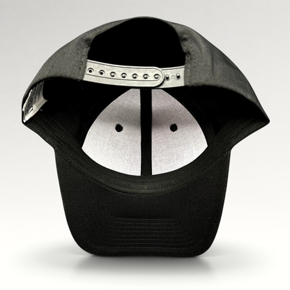 Raree Finds black snapback hat showing the interior adjustable plastic strap and white crown lining