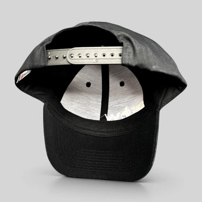Raree Finds black KC Headwear snapback hat showing the interior six-panel construction and adjustable plastic closure