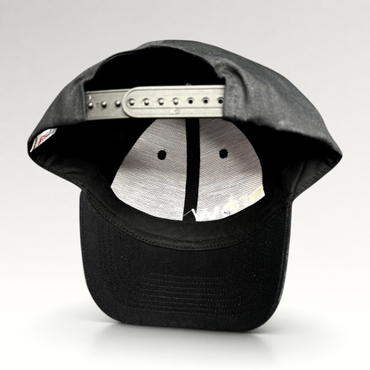Raree Finds black KC Headwear snapback hat showing the interior six-panel construction and adjustable plastic closure