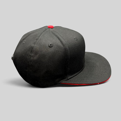 Raree Finds black flat-brim snapback hat with red button top and red underbrim detail for motorsports fans